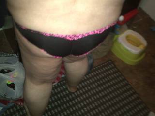 her in her black and pink panties again