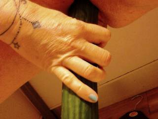 OMG...Sally is attempting to insert that huge cucumber!  BUT...she is in a store changing room!