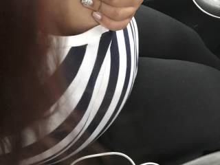 Playing with her tits before blowing me in her car.