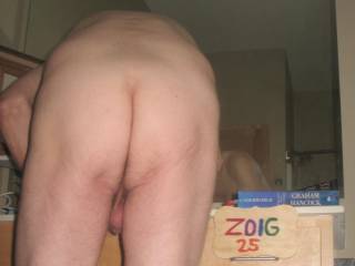 A partial body view as I bend over at the bathroom sink... showing my butt and balls... A Powershot G6 camera was used.