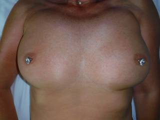 My new blingy nipple piercings at the swinger hotel in Cap D\'Agde, where we were recently on holiday.