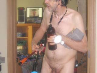 A partial body frontal as I stand near my bed room door holding a camera on a tripod and my aromatherapy stuff... I`ll be creating a new mix of oils & massage lotion...door in September,2025.  1 of 3 S70 camera`s was used.