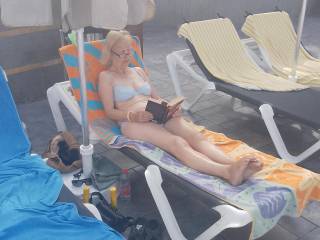 Wife having sunbathing to get a suntan.