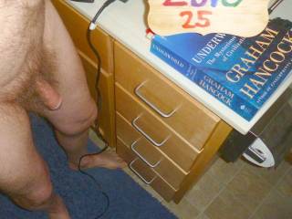 A frontal of a partial body view as I look down at the floor and my dick in my bathroom after a shower. A TS3 camera was used.