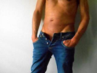 Mmmm great start.  I really love a man in jeans with his manhood begging to be free  l, then I place my hand in them and release  his growing cock for  some fun. :) Pleasure