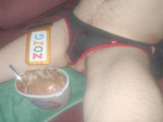 Sitting with ice cream with balls showing as I wear my new undie.