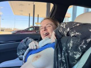 Flashing hubby in public at a gas station on our trip. I love showing off for others to see.