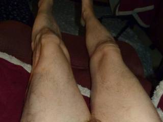 A view of my lower body that has residue of lube... dick, legs, & feet as I lay in my recliner in late April of 2024. FZ 150 camera was used.