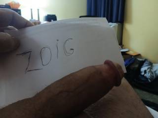 My cock laying beside zoig sign.