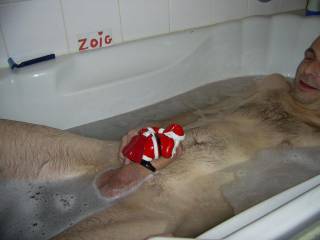 having a little fun in the bath, seems my cock has caught santa\'s attention, has it caught yours?