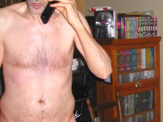A partial body frontal as I stand using a land phone in late April of 2025. A S70 camera was used.