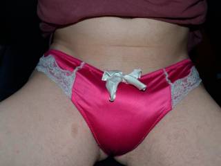 Trying some very comfortable pink nylon thong panties for size.