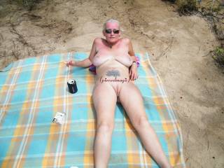 Working on my tan want to join us on the beach for some fun??