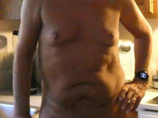 Naked in the kitchen.
