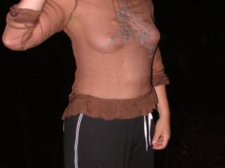 Bev camps with her water ski friends on the river. She wore this top knowing she was braless but not knowing the flash from a camera made it see through. She had no idea why she was so popular with the guys there lol