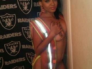 Love the work vest and the Raider background; and she's devine. Gotta Love them Raiders!