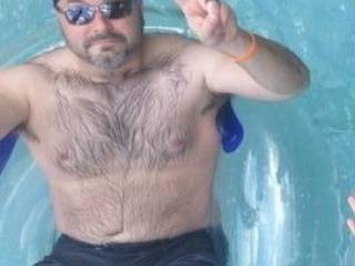 In a pool with lovely half dressed women wanting my cock sucked who wants to help?