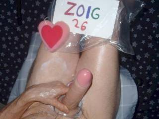 Above partial body view as I toy play sitting on my desk chair with lube spilling about my skin...A Z50 camera was used.