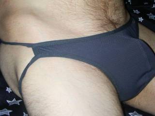 My male bottomless lingerie as I am on the bed in August of 2022.