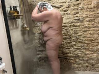 Looking for a volunteer to jump in the shower and help her soap up those huge titties