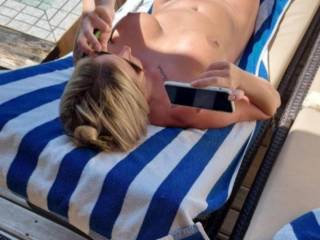 Sunning her pussy and tits