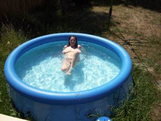 my wife look hot in the pool layed back
