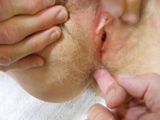 She plays and enjoys my finger in her ass