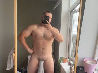 Another quick pre shower photo with the towel hanging from my hard thick cock