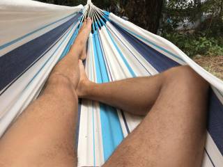 At the nudist camping laying in my hammock with a hard-on