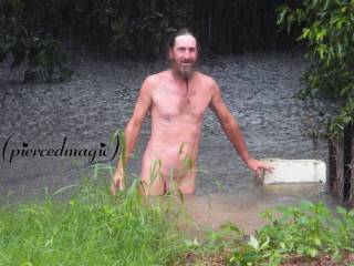Jim dick deep in our flooded back yard, hope there\'s no short legged, long nosed, swamp dogs in there!! lol!!!