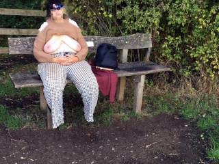 A charming sight for a first meeting. The guest arrives and smiles, seeing her waiting on a bench, wearing sunglasses and her big tits out