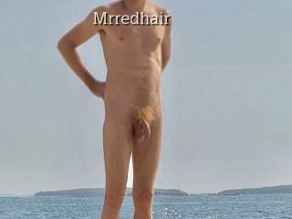 Wife took this picture of me at a public nudist beach. 
Would you like to join us and help us with the camera? 

Let me know what you think about me and my red hairy nudist dick :)