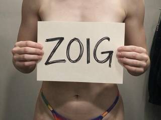 Photo with zoig sign in the closet wearing pride panties