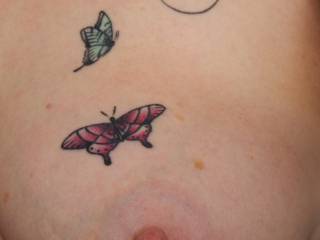 Delicate ink on a wonderful tit.
My Sussex Submissive shows off her butterfly\'s which include my initial..