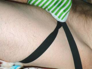 A side view of my male lingerie as I lay upon my bed in May of 2022. Pic taken with Z3 camera.