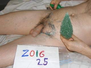 A side view as I am on my recliner with messy colored lube on my skin and hair. An Olympus C7070 camera was used remotely.