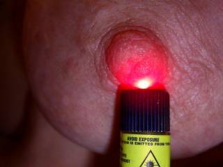 having a little fun with a laser....do you like my red hot nipple?