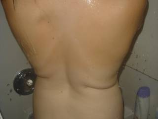 sprayed her with a load, shes washin it off