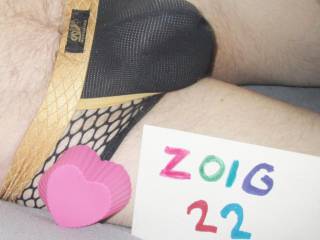 Laying in bed on February the 19th of 2022 wearing my black & gold undie & a baking heart shape.