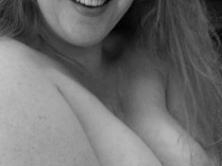 B&W of her amazing pregnant rack and her beautiful smile