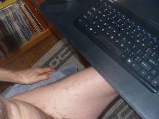 A side and above scene of my dick and lubed hair after some toy play as I am at my desk/PC keyboard. Z50 Camera was used.