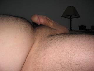 laying in bed with a hard on
