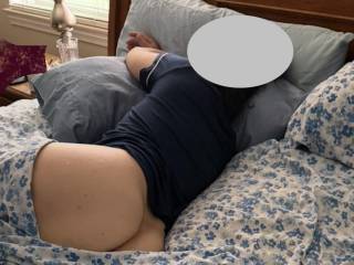 Laying in bed with no panties on.
