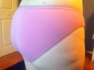 Here\'s my nice round behind in my pink panties. Would you kneel behind me a slowly remove my panties?