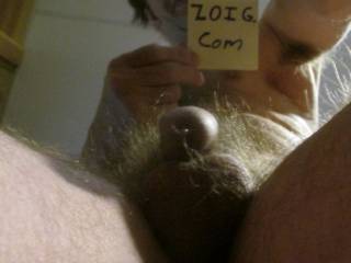 A view from below of my fluid upon my tip & balls,with my face also...