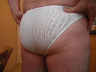 I love the way tight shorts and briefs accentuate the contours of men\'s asses.  This is my ass in a one of my favourite pairs of white briefs and I hope you like what you see