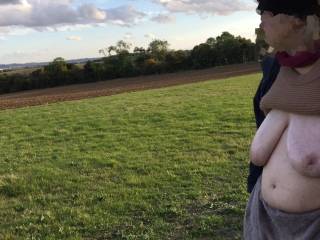 A lady with oiled tits looks at the lovely view - as do I :)