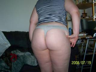 Lupo's wife showing off some panties she had bought to wear for me.  Whoelse loves that round ass of hers?