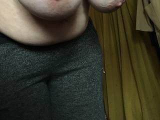 Hanging her big tits in an upstairs room