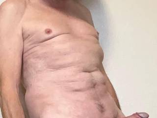 Amateur picture, totally naked, with my penis growing hard.